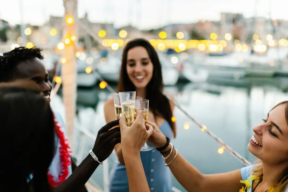 Group toasting aboard at the marina